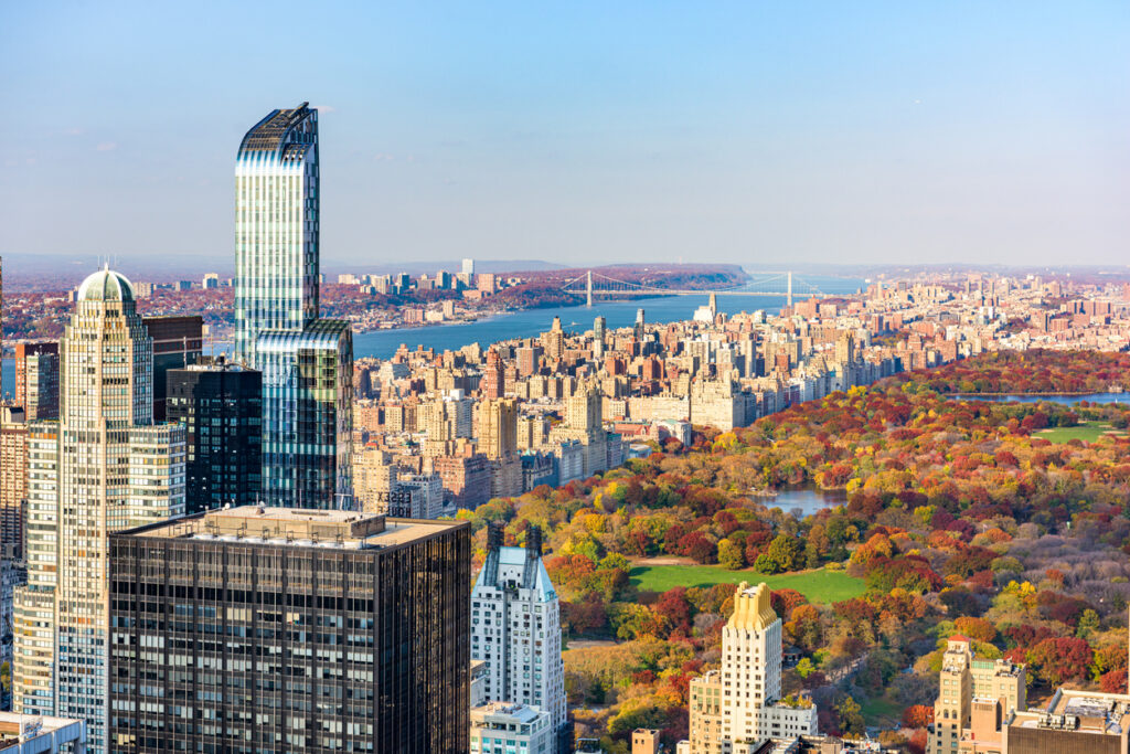 City skyline with vibrant autumn foliage