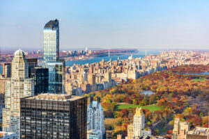 City skyline with vibrant autumn foliage